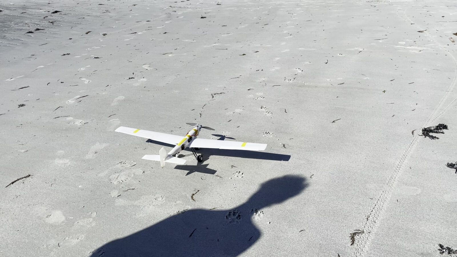 Sandpiper RC aircraft on the beach before its test flight