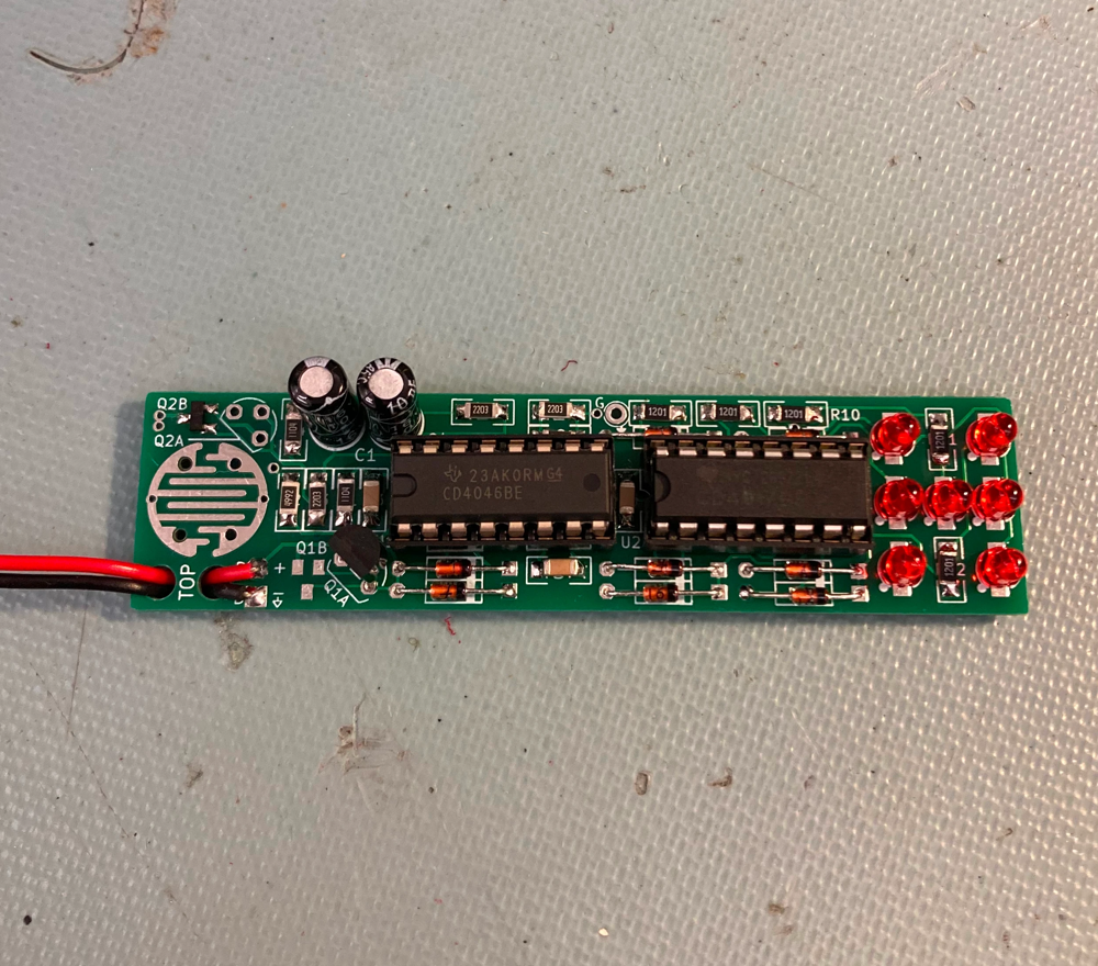 Hand-soldered digital dice circuit with through-hole and surface-mount components